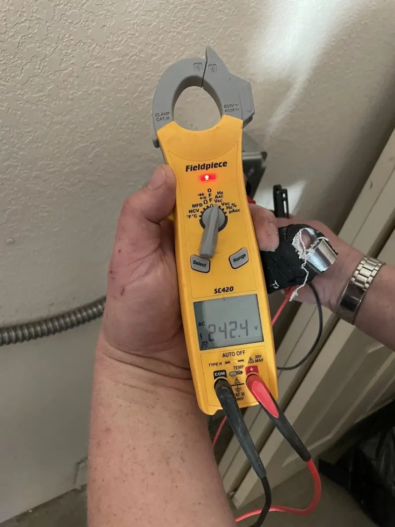 Voltage testing with clamp meter during Electrical Installation Services in Seacliff